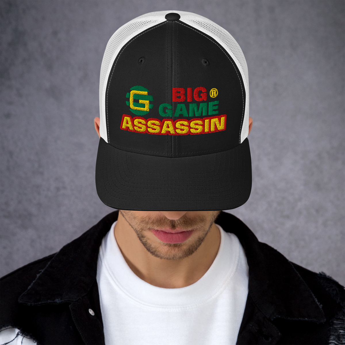 BIG GAME ASSASSIN® Triple C's Trucker Cap (layered text). Red, green and yellow design. Available in a variety of colours. One size.