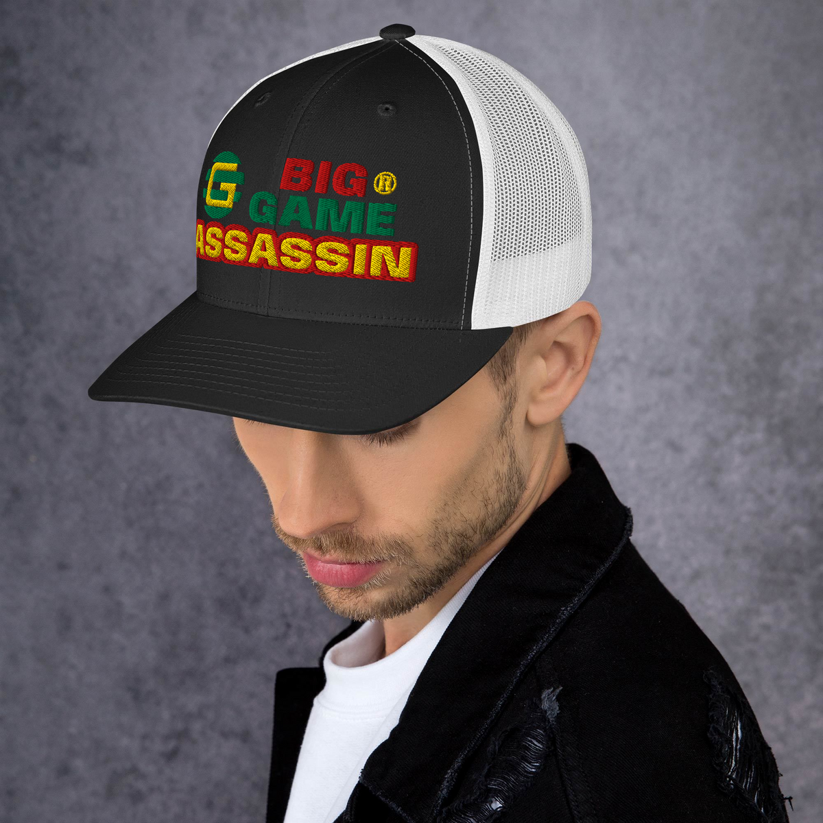 BIG GAME ASSASSIN® Triple C's Trucker Cap (layered text). Red, green and yellow design. Available in a variety of colours. One size.