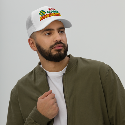 BIG GAME ASSASSIN® Triple C's Trucker Cap (layered text). Red, green and yellow design. Available in a variety of colours. One size.